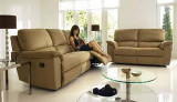 Woman sitting on furniture village sofa