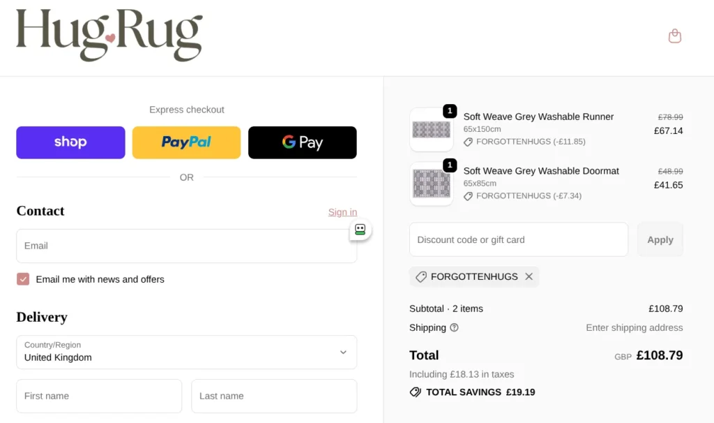 Hug Rug checkout page showing discount code applied and total savings.